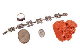 A group of items to include; a piece of coral carved with a scarab beetle and leaves, 37.0g, a paste