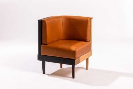 A prototype corner chair, made by Benchmark, tan leather and specimen woods, 81 cm high x 62 cm wide