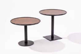 A graduated pair of circular occasional tables, walnut effect tops on ebonised bases, one square bas