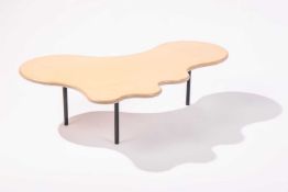 A shaped ply coffee table, on three legs, 31 cm high x 109 cm x 75 cm..