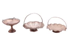 A Victorian swing handled cake basket; circular with an undulating border and pierced and chased wit