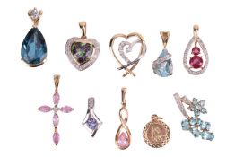 A collection of ten pendants; mostly set with coloured gemstones, including examples of topaz, ruby,