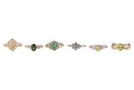 Six rings in 9ct gold set with green and yellowish gemstones; to include a chrome diopside solitaire