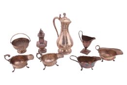 A Victorian silver communion wine flagon/jug, of panelled circular form, marks rubbed, Birmingham 18