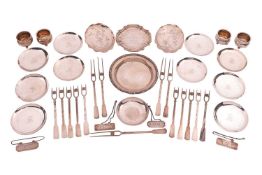 Two Chinese white metal pin trays engraved with birds and prunus blossom, on ball feet; together wit