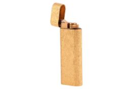 Cartier - a Must De Cartier gold-plated Briquet lighter, with chiselled texture design, signed and n