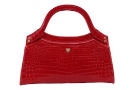 A Lana Marks handbag in red crocodile leather, of tapered rectangular form, with double top handles,