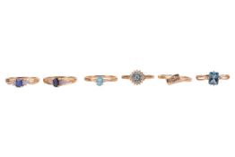 A group of 9ct gold gem-set rings, including a blue topaz ring, size S, an apatite ring, size T, a s