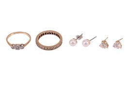 A diamond-set dress ring, illusion-set with three single-cut diamonds, in a bi-colour metal mount ma