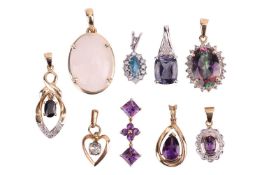 A collection of nine gem-set pendants; to include examples of an iolite and diamond pendant in 9ct w