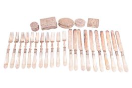 An early 20th century small Chinese export silver dressing table pot, decorated throughout with bamb