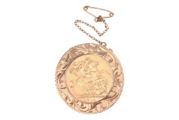A 1914 George V full sovereign mounted in 9ct gold, in a detachable circular surround engraved with 