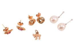 A small group of jewellery items comprising a pair of ruby-set earrings, in yellow metal marked ‘14K