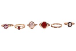 A 9 carat gold and carnelian signet ring, together with a single stone moonstone ring, two gem-set c