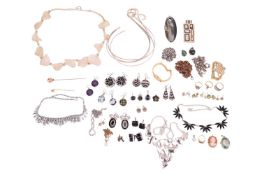 A shell cameo of a lady in an oval mount marked 10k, together with a 9 carat gold ring set with thre