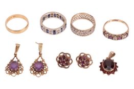 An 18 carat gold wedding band (2.2 grams), together with three gem-set rings, a pair of 9 carat gold