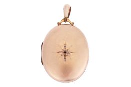 A gilt diamond-set locket, the oval cover centred with a star motif encrusted with rose-cut diamond 