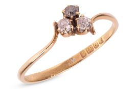 An Edwardian-style three-stone trefoil style diamond ring, the claw-mounted old-cut diamonds in an 1