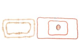 Two coral bead necklaces, an oval shell cameo of a lady in a gilded white metal frame, and two carve