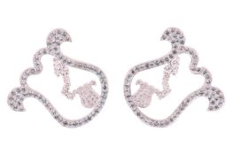 A pair of modern pale-blue topaz and diamond ear studs, assumed by Caratiff, each in the form of an 