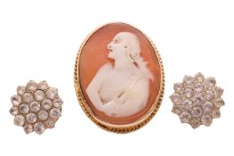 A cameo ring, featuring a central oval cameo of 25mm x 19mm, depicting a female figure carrying a fo