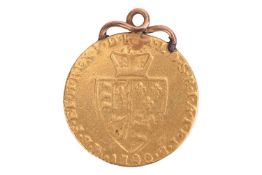A George III 1790 Gold Spade Guinea, with applied mount. 8.3 grams, 24 mm diameter.