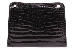 Cartier - an evening handbag in black crocodile skin leather, circa 1960s, of rectangular shape, kis