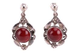 A pair of Arts and Crafts drop earrings, of floral and scrollwork design, each centred with a round 