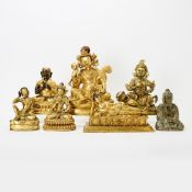 Group of Six Sino-Tibetan Style Gilt Bronze and a Stone Figural Sculpture