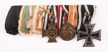 Ordensspange mit sieben Bändern und insgesamt 3 Auszeichnungen bestehend aus Ehrenkreuz für