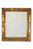 A GILTWOOD WALL MIRROR IN BAROQUE TASTE, 19TH CENTURY