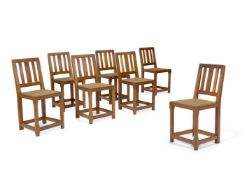 A SET OF SEVEN ARTS & CRAFTS OAK SIDE CHAIRS, CIRCA 1910
