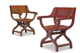 A NEAR PAIR OF OAK AND LEATHER UPHOLSTERED ARMCHAIRS, CIRCA 1880