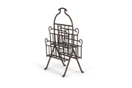 AN AESTHETIC MOVEMEMENT BRASS MAGAZINE RACK, LATE 19TH CENTURY