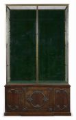 A MAHOGANY, BRASS FRAMED AND EMERALD SILK VELVET-LINED DISPLAY CABINET