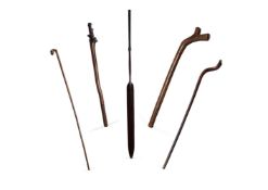 A GROUP OF TRIBAL CLUBS AND WALKING STICKS TO INCLUDE: Fijian Vunikau club