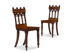 A PAIR OF GOTHIC REVIVAL OAK HALL CHAIRS, SECOND QUARTER 19TH CENTURY