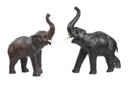 A LEATHER ELEPHANT FOOTSTOOL, ATTRIBUTED TO OMERSA FOR LIBERTY, AND ANOTHER SIMILAR