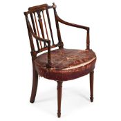 A GEORGE III CARVED MAHOGANY ARMCHAIR, IN THE MANNER OF THOMAS SHERATON, CIRCA 1780