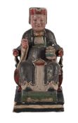 A CHINESE CARVED AND POLYCHROME PAINTED FIGURE OF A SEATED OFFICIAL, 18TH OR 19TH CENTURY