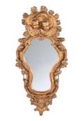 AN ITALIAN CARVED GILTWOOD MIRROR, 18TH CENTURY