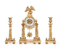 A FRENCH GILT METAL AND YELLOW ALABASTER MOUNTED THREE PIECE CLOCK GARNITURE, IN EMPIRE STYLE