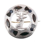SCOTTISH INTEREST: AN EDWARDIAN SILVER AND HARDSTONE BROOCH