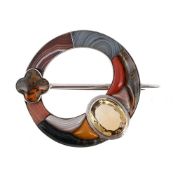 SCOTTISH INTEREST: A LATE 19TH CENTURY HARDSTONE AND CITRINE ANNULAR BROOCH