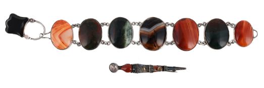 SCOTTISH INTEREST: A HARDSTONE PANEL BRACELET AND A DIRK BROOCH