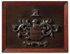 A CARVED AND STAINED WOOD ARMORIAL PANEL