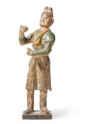 A LARGE SANCAI GLAZED POTTERY FIGURE OF A CAMEL GROOM, TANG DYNASTY (618-907 AD)