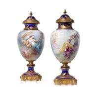 A PAIR OF POTTERY GILT-METAL MOUNTED SÈVRES-STYLE URNS AND COVERS, FRENCH