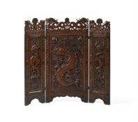A CHINESE OR SOUTH EAST ASIAN HARDWOOD CARVED THREE-FOLD 'DRAGON' SCREEN, LATE QING DYNASTY