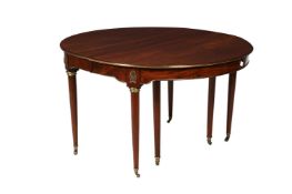 A CONTINENTAL MAHOGANY AND BRASS MOUNTED EXTENDING DINING TABLE, 19TH CENTURY